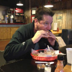 Joel bites into the long awaited brisket sandwich at Southern Smokehouse Lafayette, IN