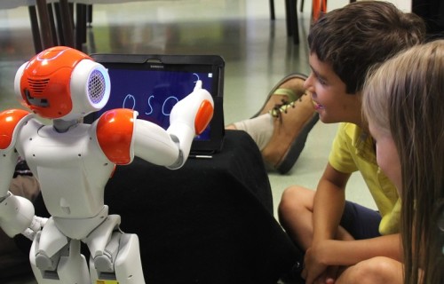 The NAO robot CoWriter teaching kids how to write