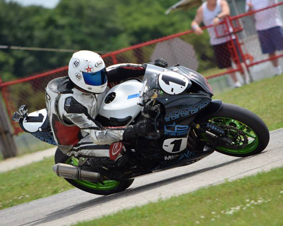 The black-ish ZX6 with green wheels looks menacing 
