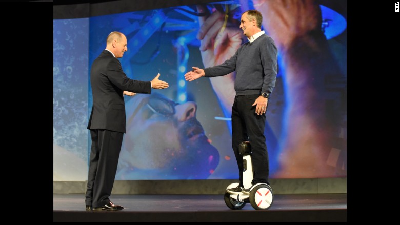 Intel CEO Brian Krzanich trying out the Segway Robot.  Image via CNNMoney