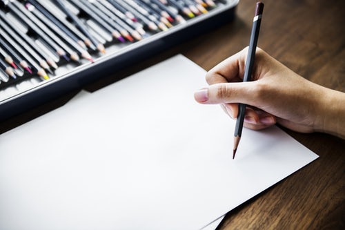 Someone sketching with a pencil