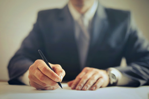 Guy in a suit at a corporate training event