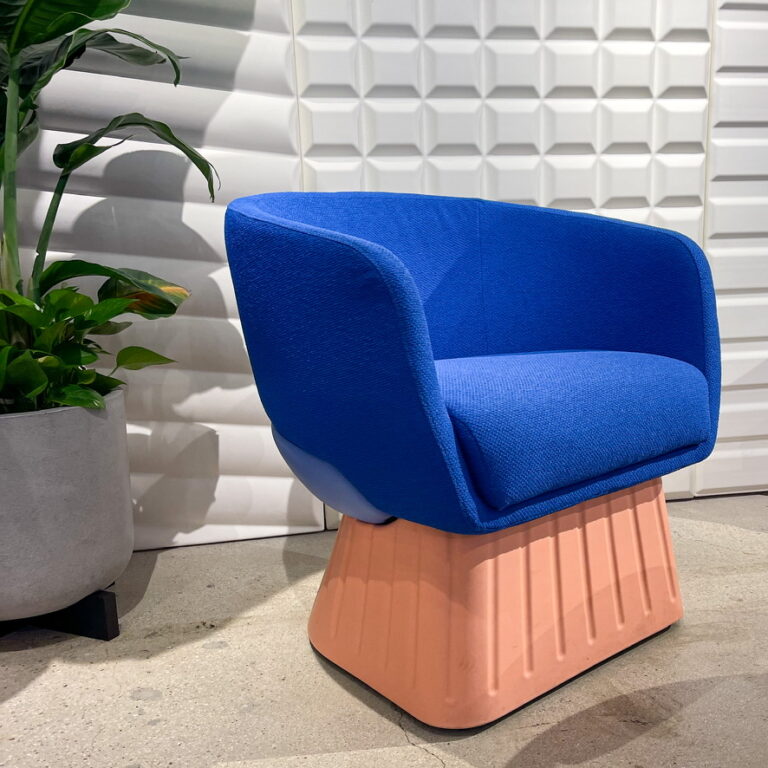 A blue and pink designer chair from the Sixinch display at NeoCon 2023