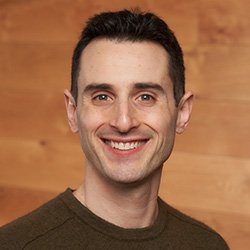 Am image of Sam Kriegman on a brown background